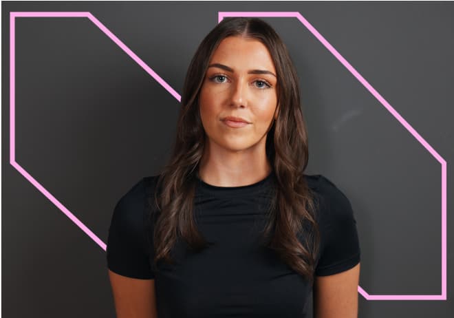 girl standing in front of a black background 