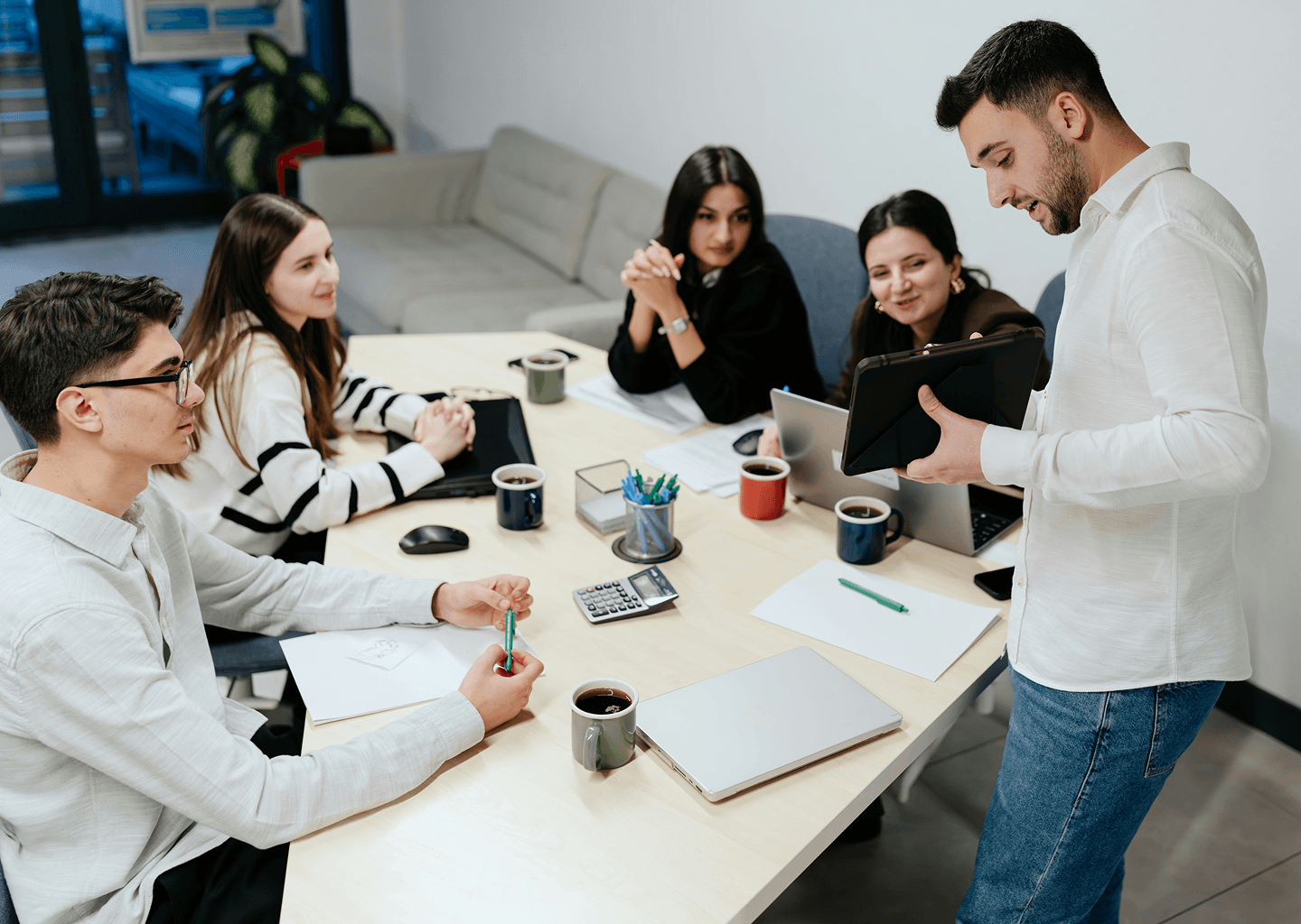 Image showing team discussing is your CRM a liability.